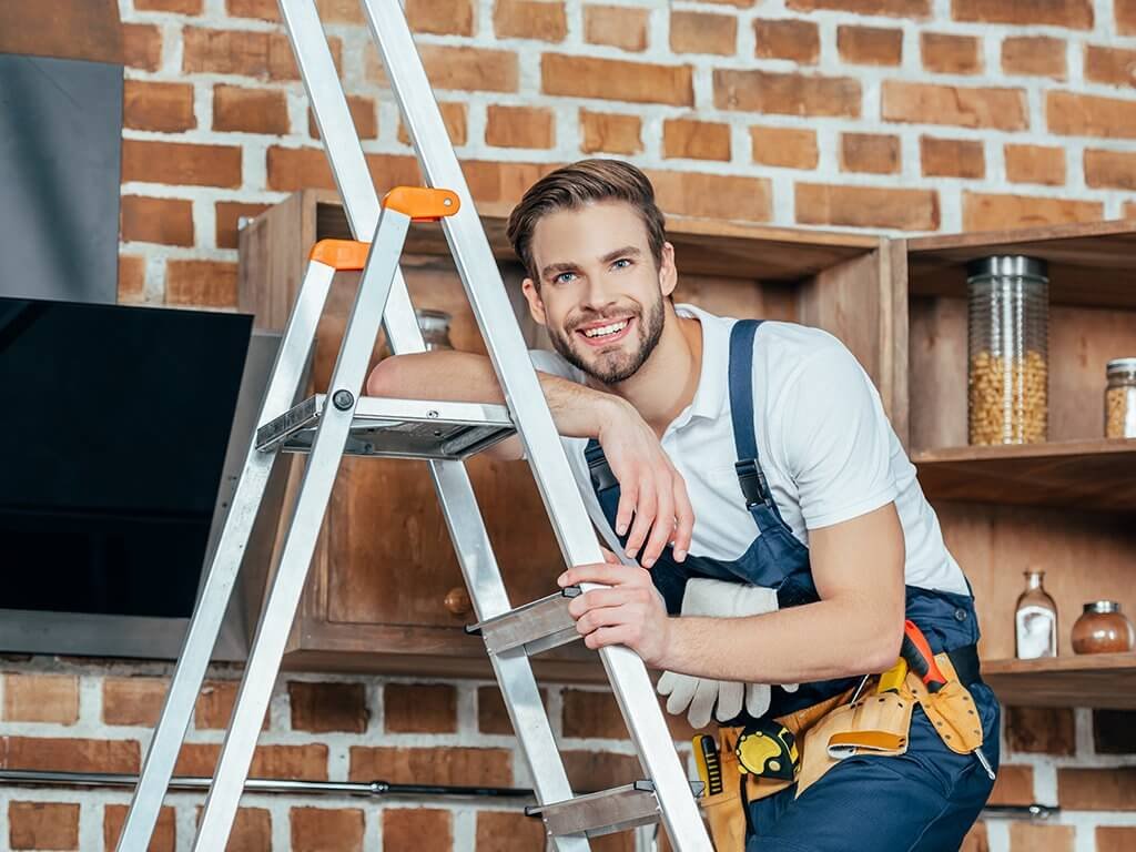 Maintenance worker on a ladder
