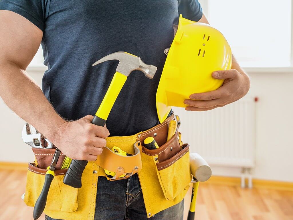 Technician holding tools